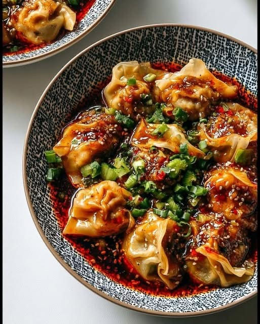 Chicken Wontons in Spicy Chili Sauce