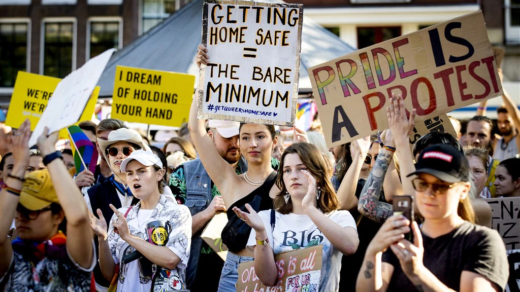 Queer people protesting at the Homomonument in Amsterdam.