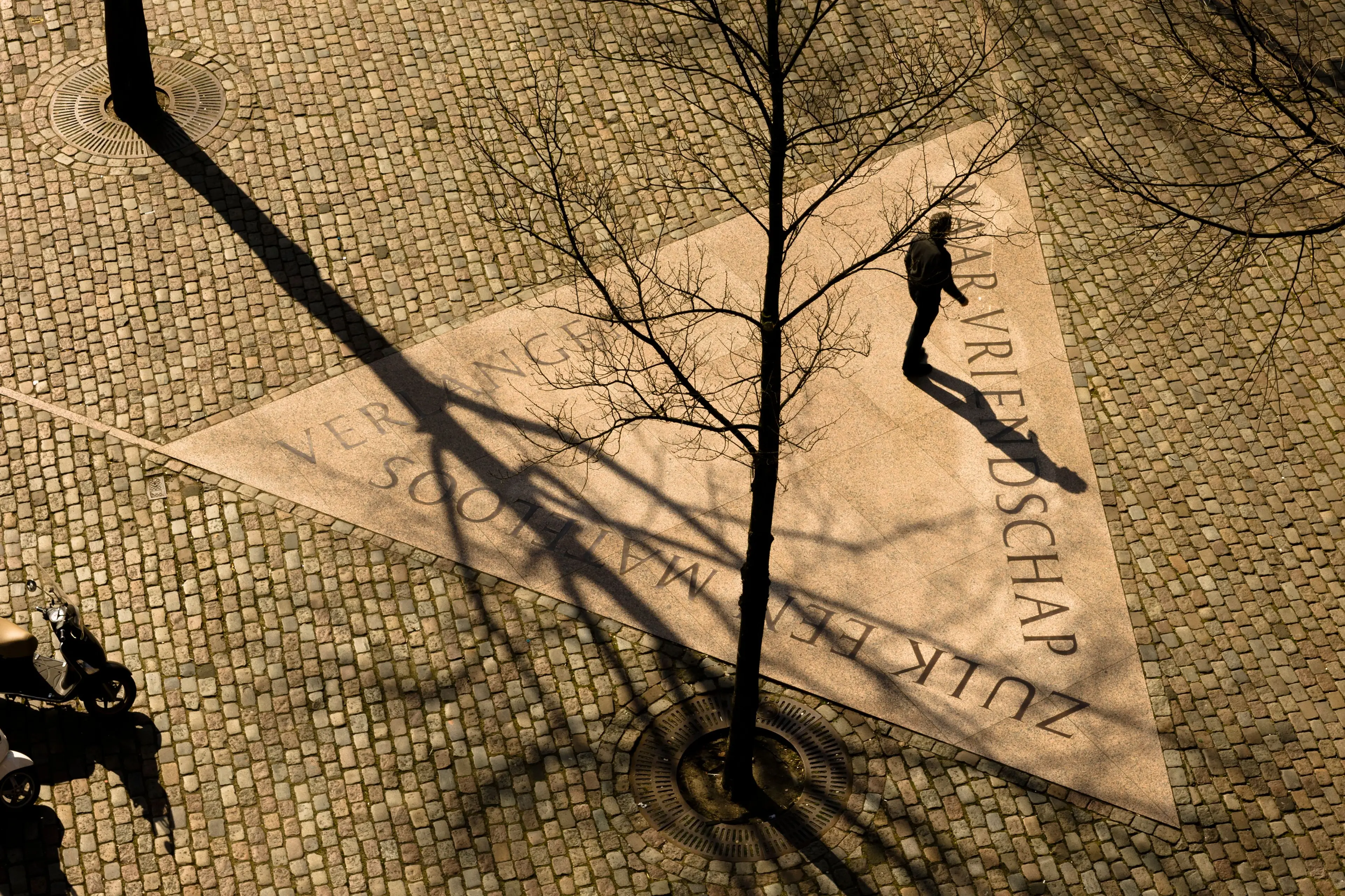 One of the triangles composing the Homomonument in Amsterdam with the carved words "To friendship, oh such a limitless longing"