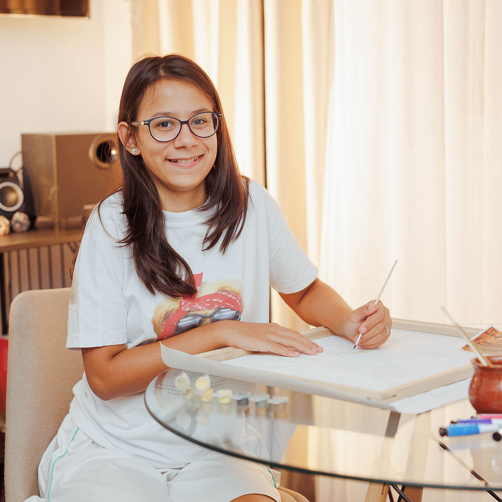 Thumbnail: Image of a young girl painting on a numbered linen framed canvas, part of our custom paint by numbers kits.