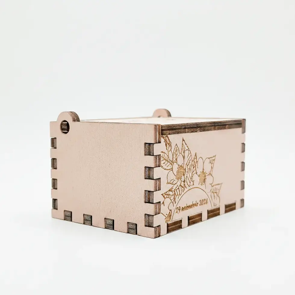 Miniatură: Handcrafted small wooden keepsake music box in a natural finish with floral side engraving.