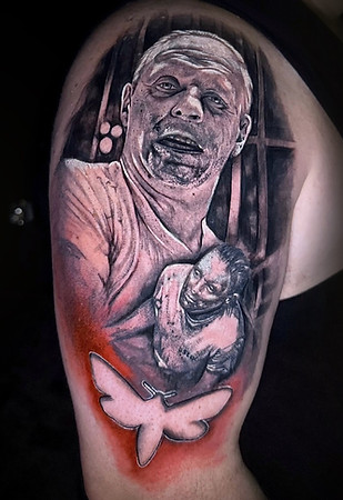 tattoo photo of Hannibal lector on an upper bicep