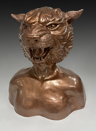 ceramic sculpture of a tiger head on a human shoulder girdle area