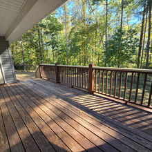 Wood deck overlooking the wooded backyard