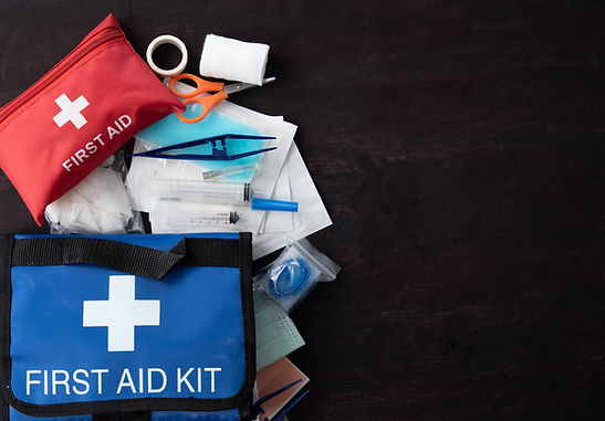 First aid medical kit on wood background,copy space,top view.jpg