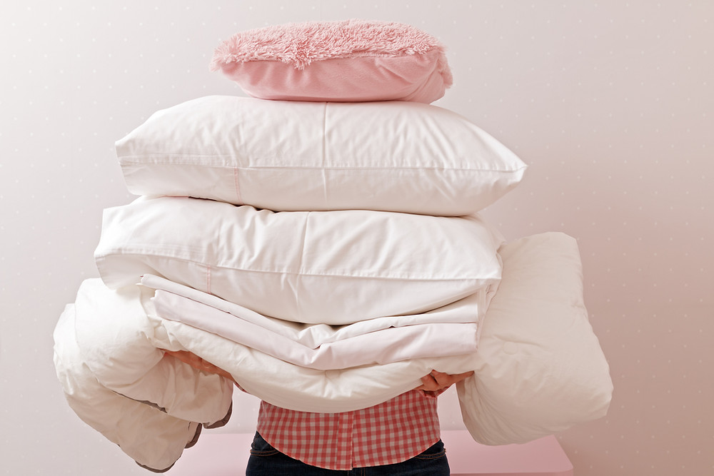 person holding pillows pillow play to build motor skills children by kozie clothes