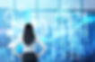 Rear view of the brunette woman who is looking out the window in the panoramic office in N