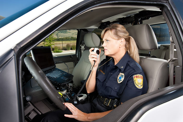 Female police officer speaking over radio