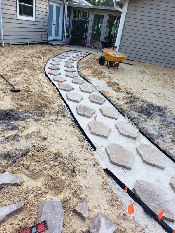 Jump into the Process of our recent job of a beautiful paver and fireplace sitting area!