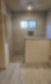 bathroom tile flooring Phoenix AZ with walk in shower and wood look tile walls
