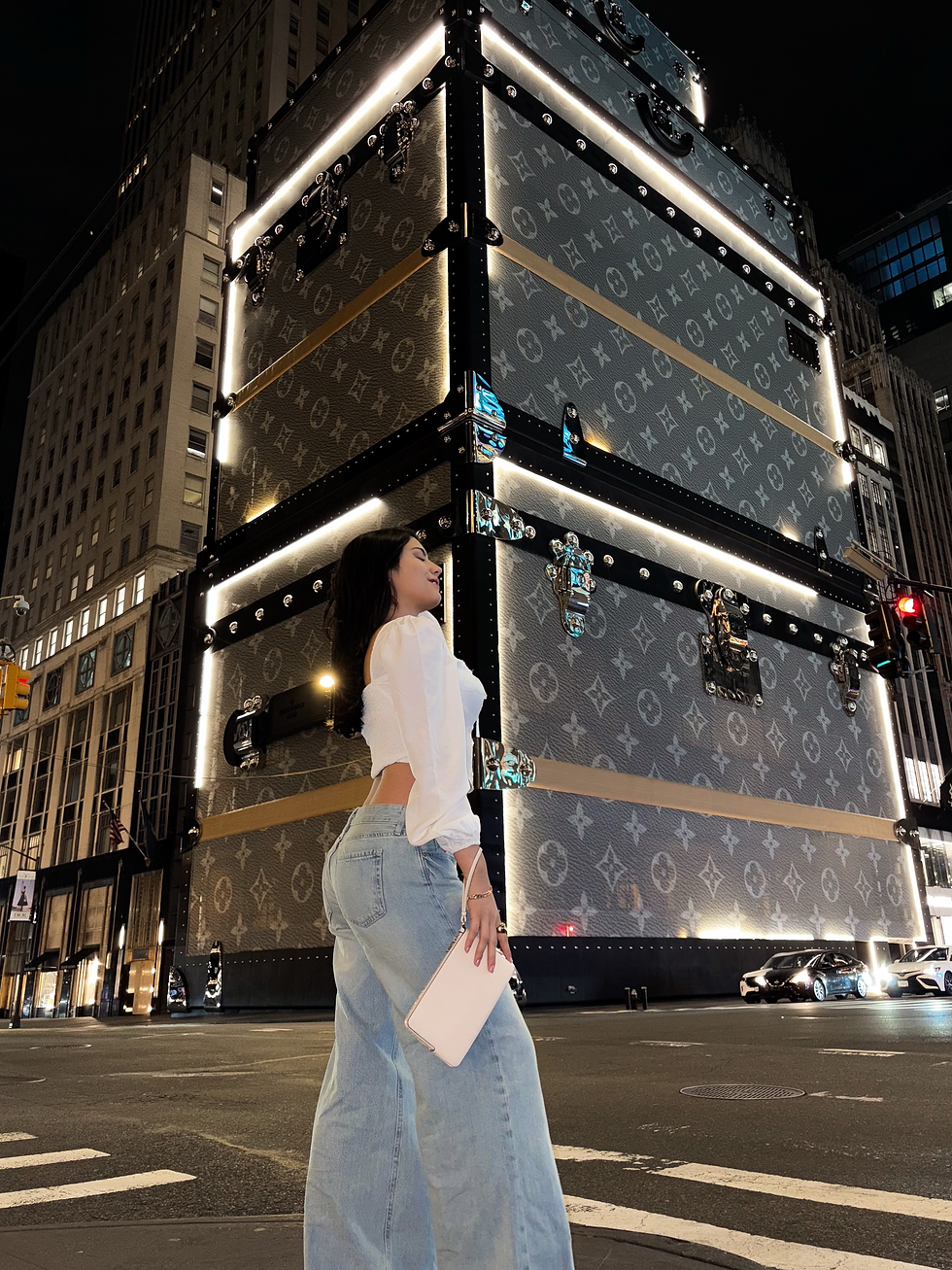 Taisha in front of Louis Vuitton flagship, a unique store designed to look like a luxury trunk. Taisha draws her creative inspiration from an array of such unique designs around NYC.