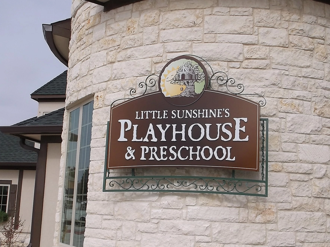 daycare, ornate iron, wall sign