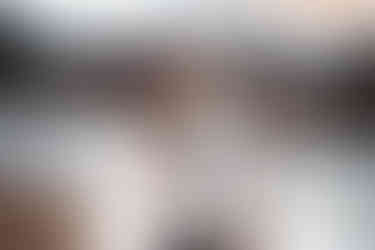 Maternity photo of couple snuggling a winter evening