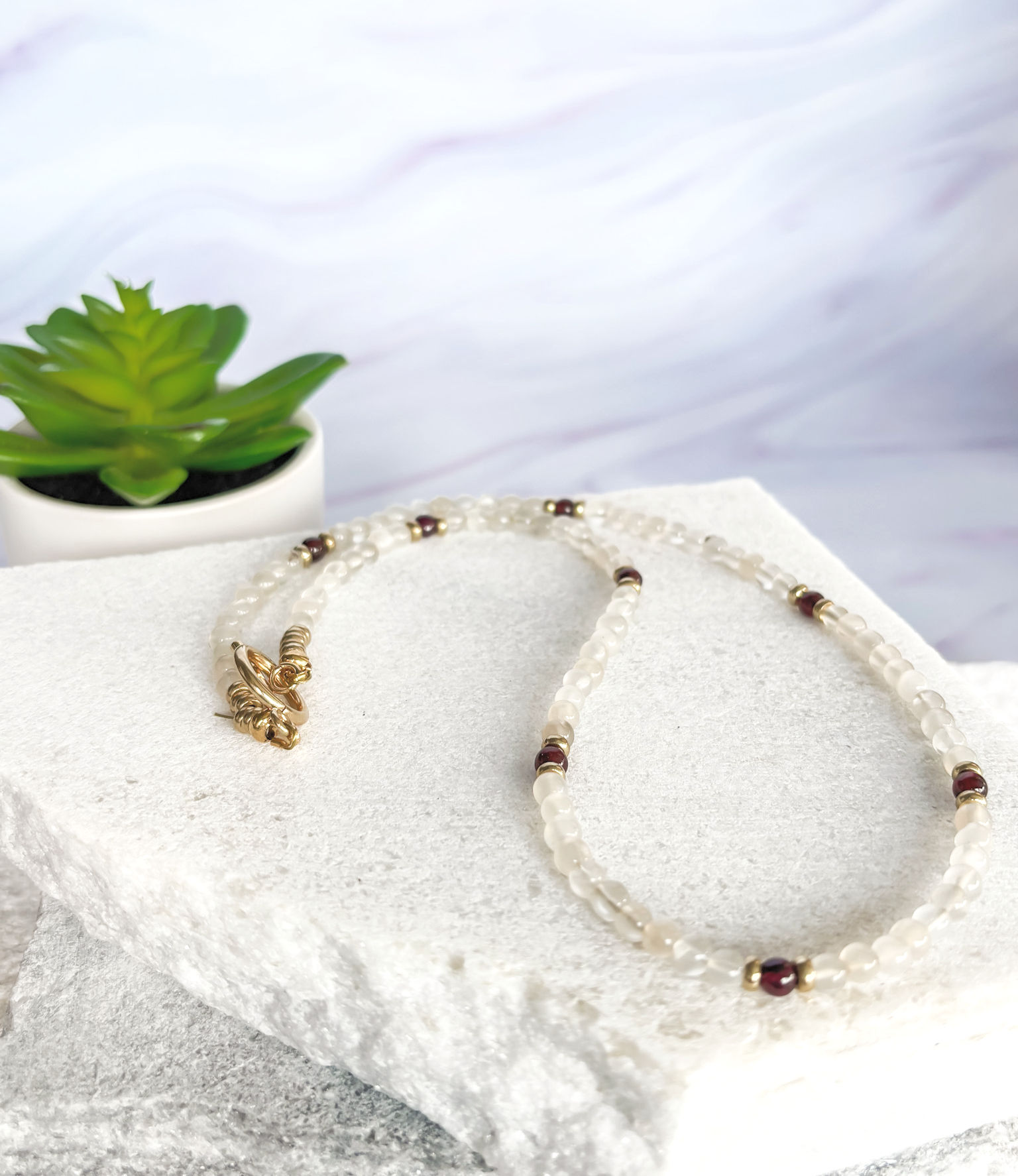 clear quartz and garnet necklace