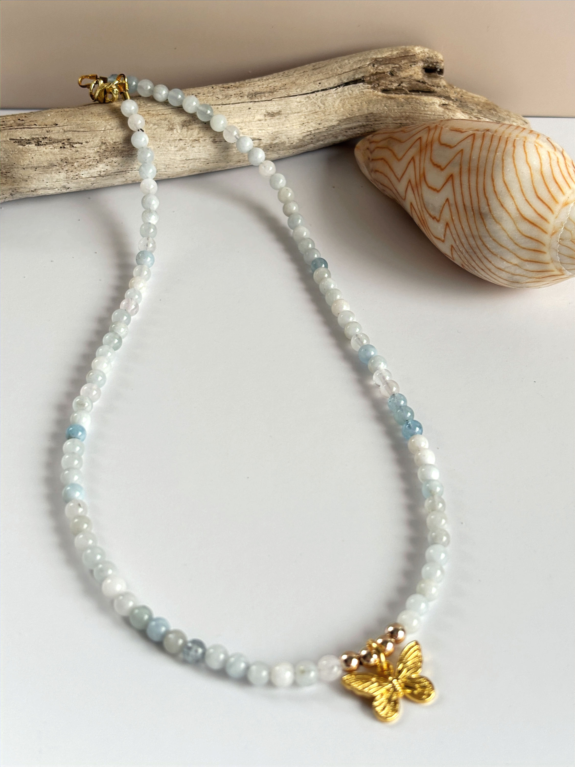aquamarine necklace and. butterfly charm