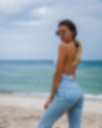 woman in jeans and bathing suit