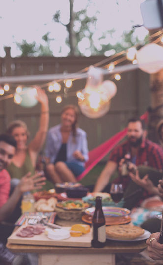 Friends and family gathered under clear beautiful skies sharing joy, laughter and love.