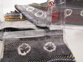Woven cassette tapes in plastic cases