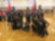 Image of the twelve-member BHMA Buzzer Beaters team posing with their ribbons after competing in the SOMA Winter Games tournament.