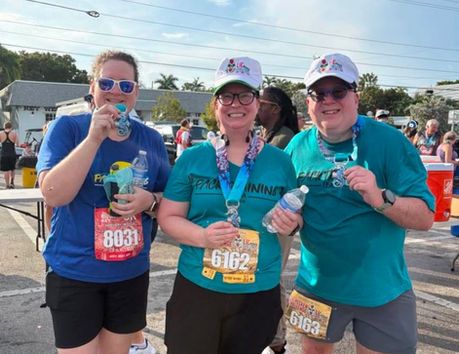 Members showing off their Key West Half Marathon medals.