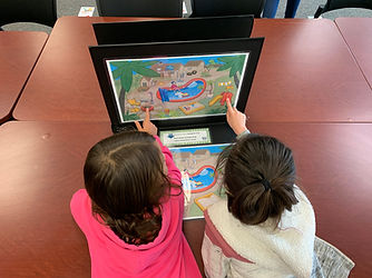 Students engaging with a n EcoHealth hands-on game.