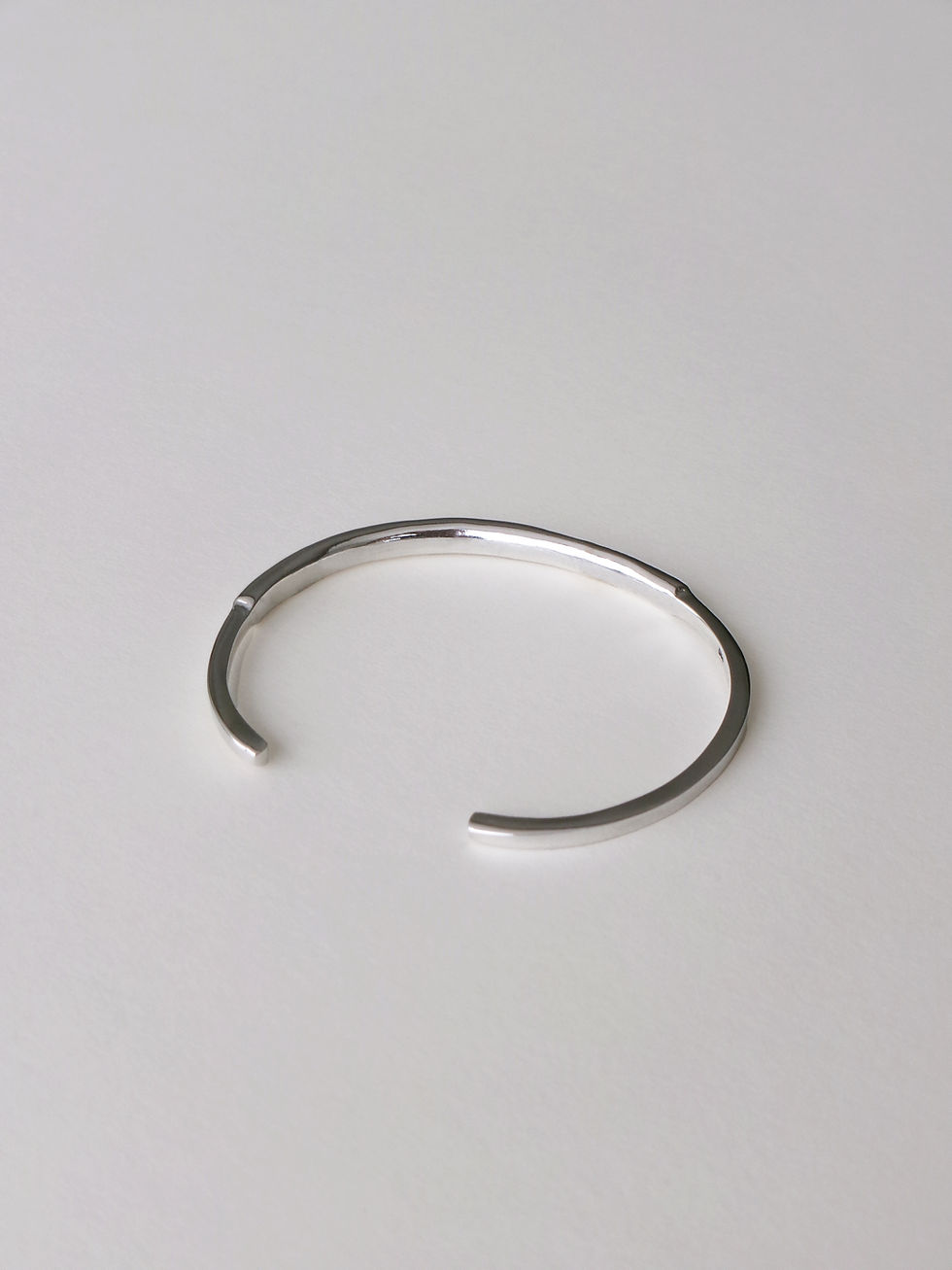 Thumbnail: asymmetrical tube bangle