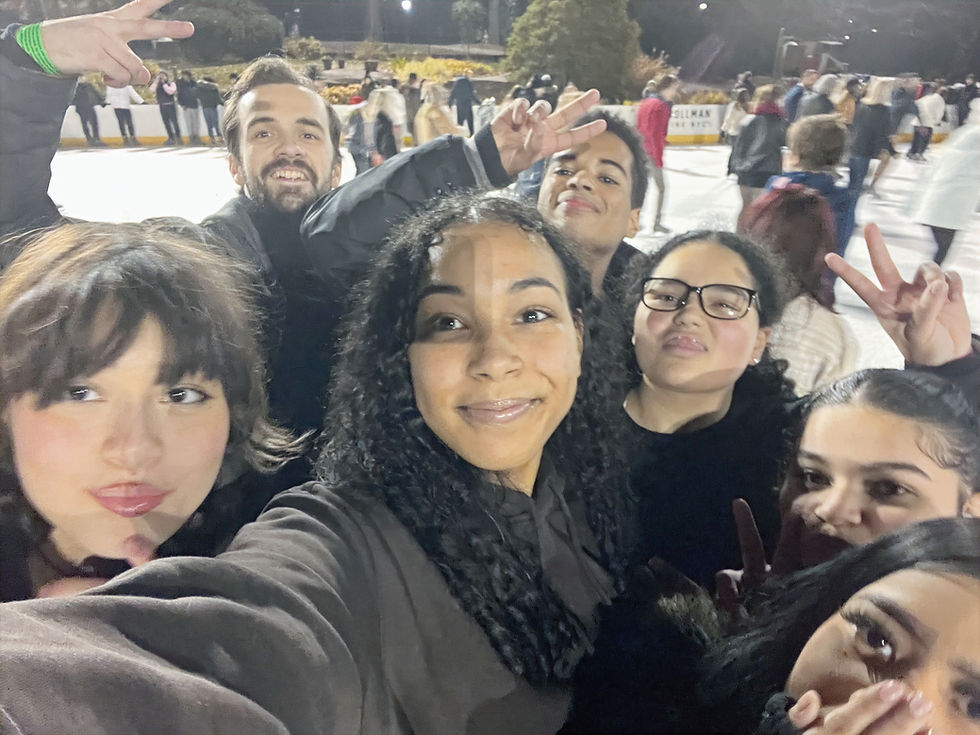 Smiling students ice-skating at Discovery High School