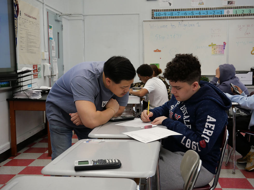 Teacher assisting student with classwork