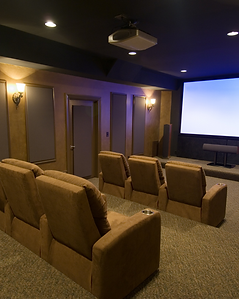 Luxury home theater with recliners and projector setup