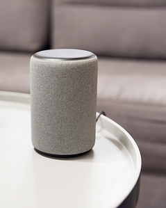 Smart speaker in home theater issuing voice command for movie scene