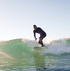 Surf and stay photo of a a guets surfer enjoyinf his ride