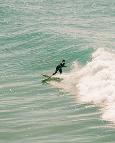Advanced surfer going down the line of a beautiful wave in Morocco