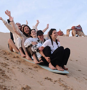Guests feel like a small community having fun sliding at the sand dunes