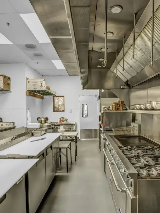 Commercial kitchen at Tiffin’s India Café with electrical systems supporting restaurant equipment and kitchen operations.