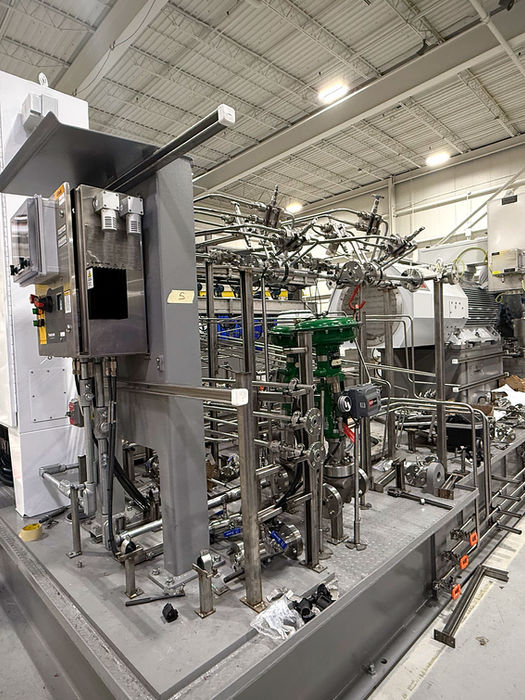 Electrical integration work on custom industrial pump skid system with power and controls installation in Colorado manufacturing facility