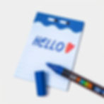 Thumbnail: a notepad with a wavy, dark blue design with two eyes, "hello" with a heart is written on it with a posca marker
