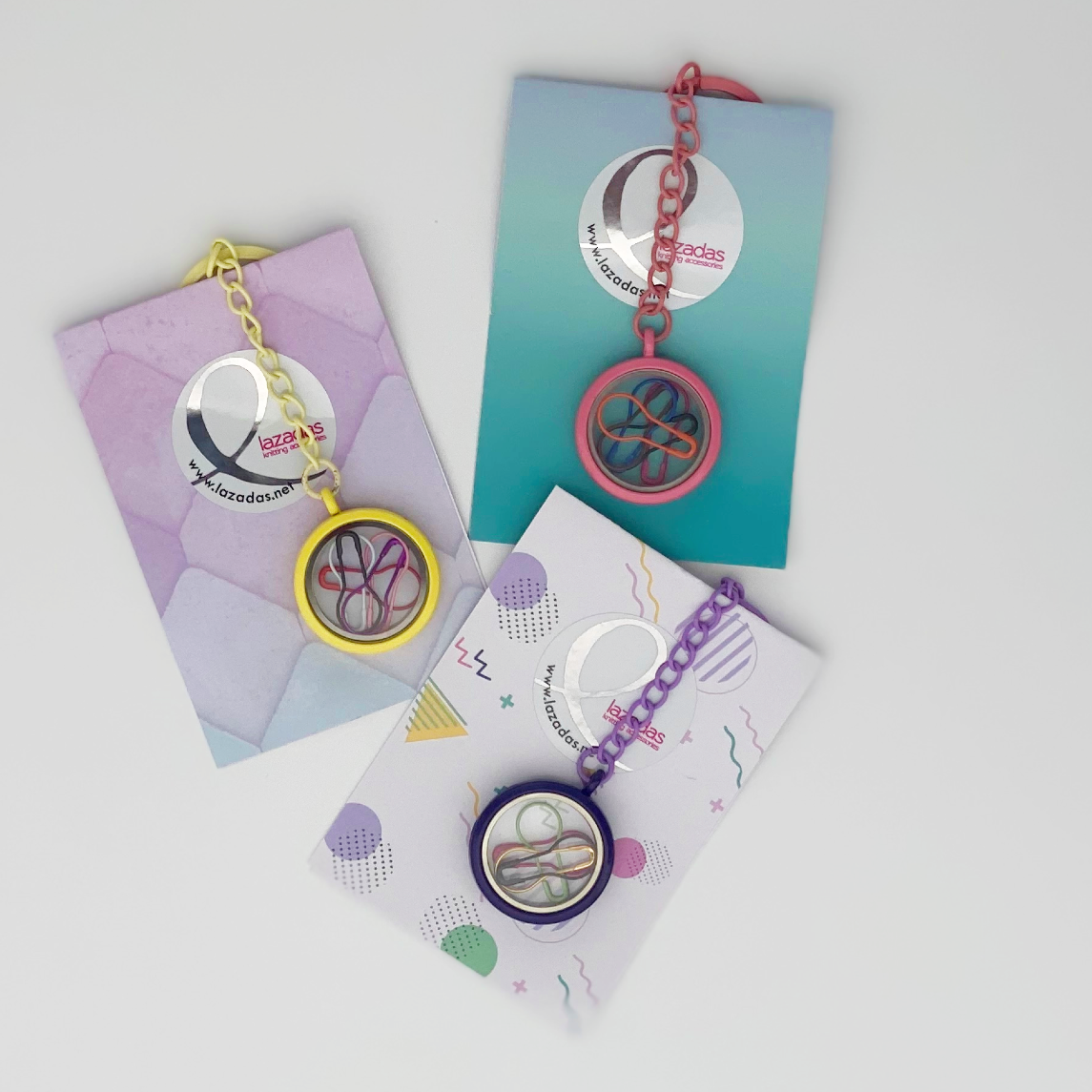 3 keychains in the package. one yellow, one purple and one pink.