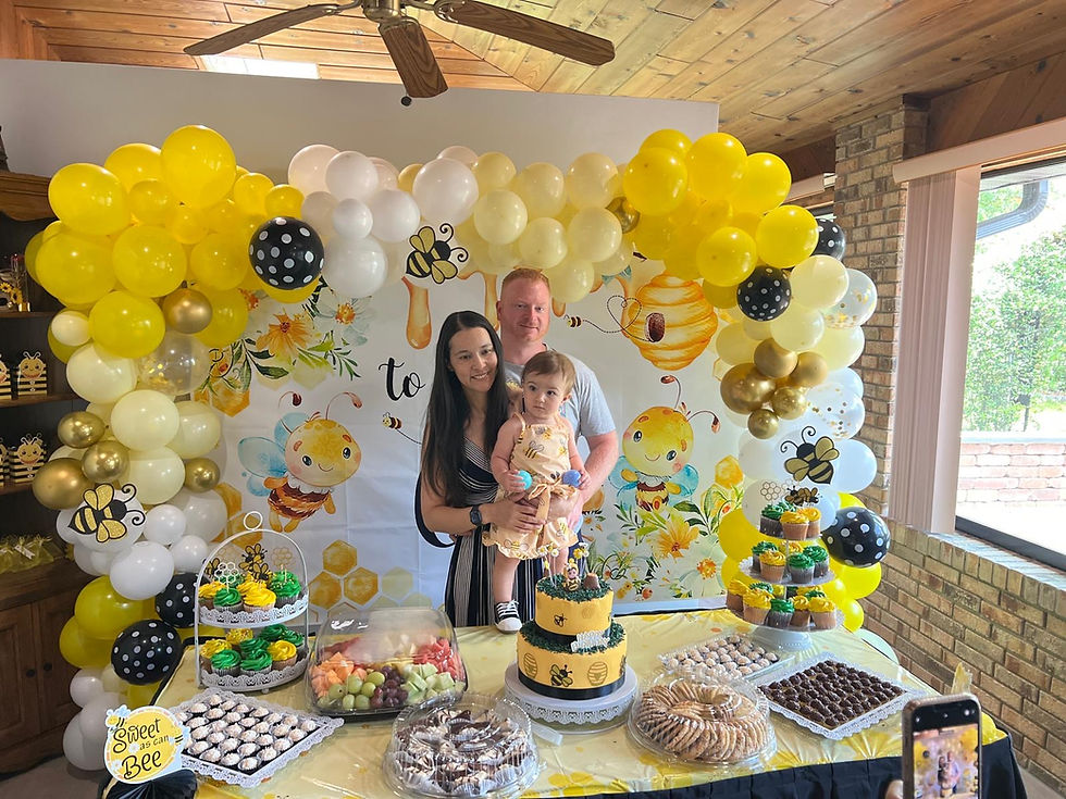 Stephen Gensel, Daniela, and their daughter celebrating a family birthday together.