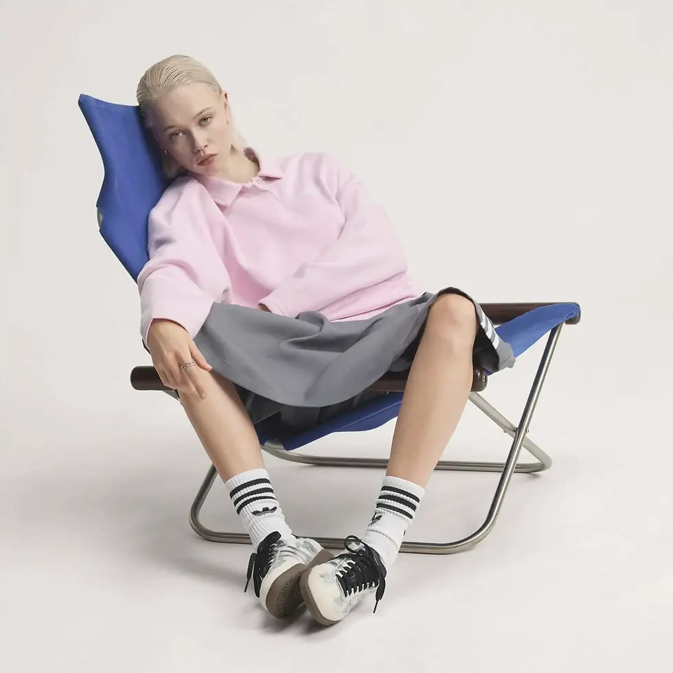 Adidas Samba OG Womens Sneakers KJ2314 in cream white silver on model sitting in folding chairmetallic