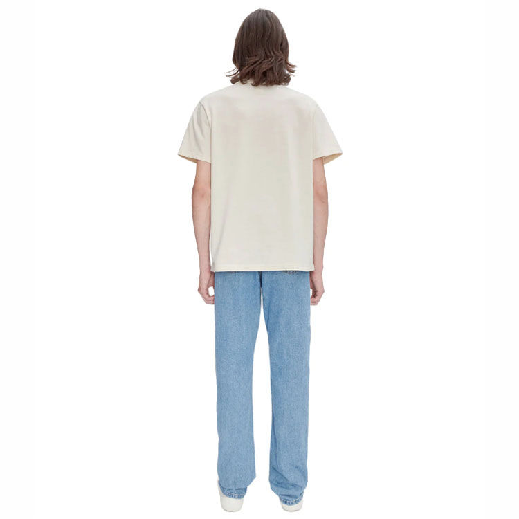 APC Standard Jeans in heavy stone wash indigo denim on model full back