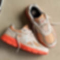 new-balance 990v4 sneakers u990mo4 in moonbeam, tangerine-dream, dried-orange sneakers laying on a floor