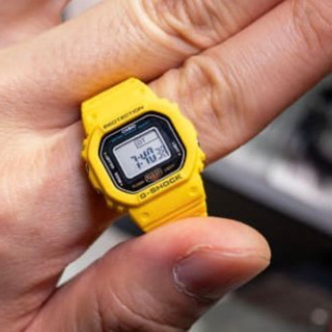 Casio Ring Watch DWN5600-9 in yellow on model fingher