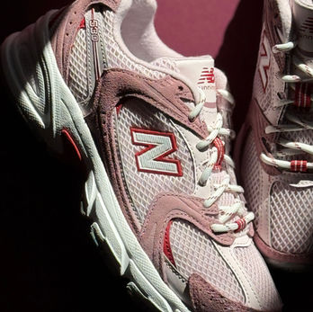 New Balance U530 Women's Sneakers in red, white and pink