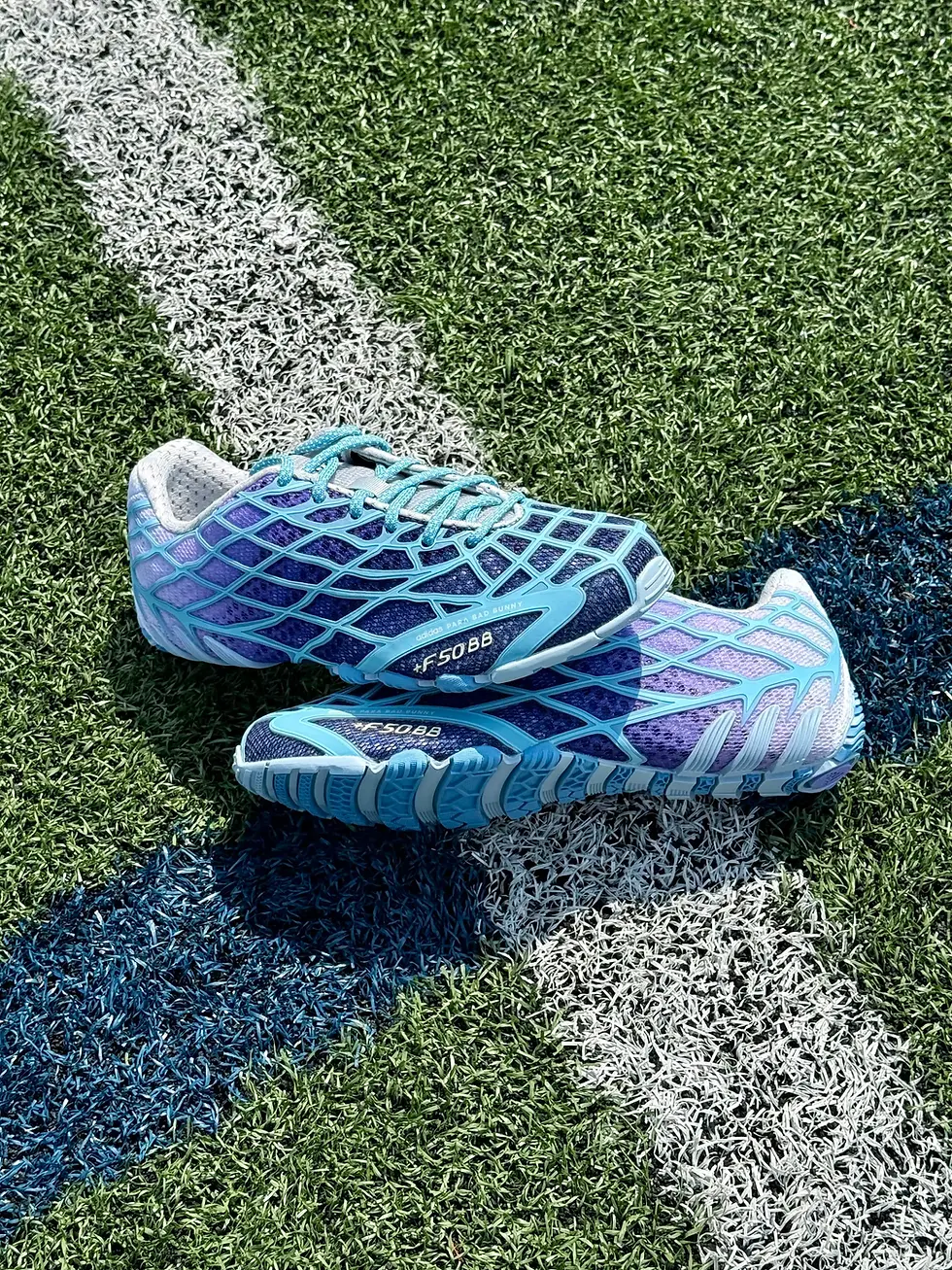Adidas Bad Bunny F50 Ghost Sprint Sneakers KI9450 in dark marine on football field