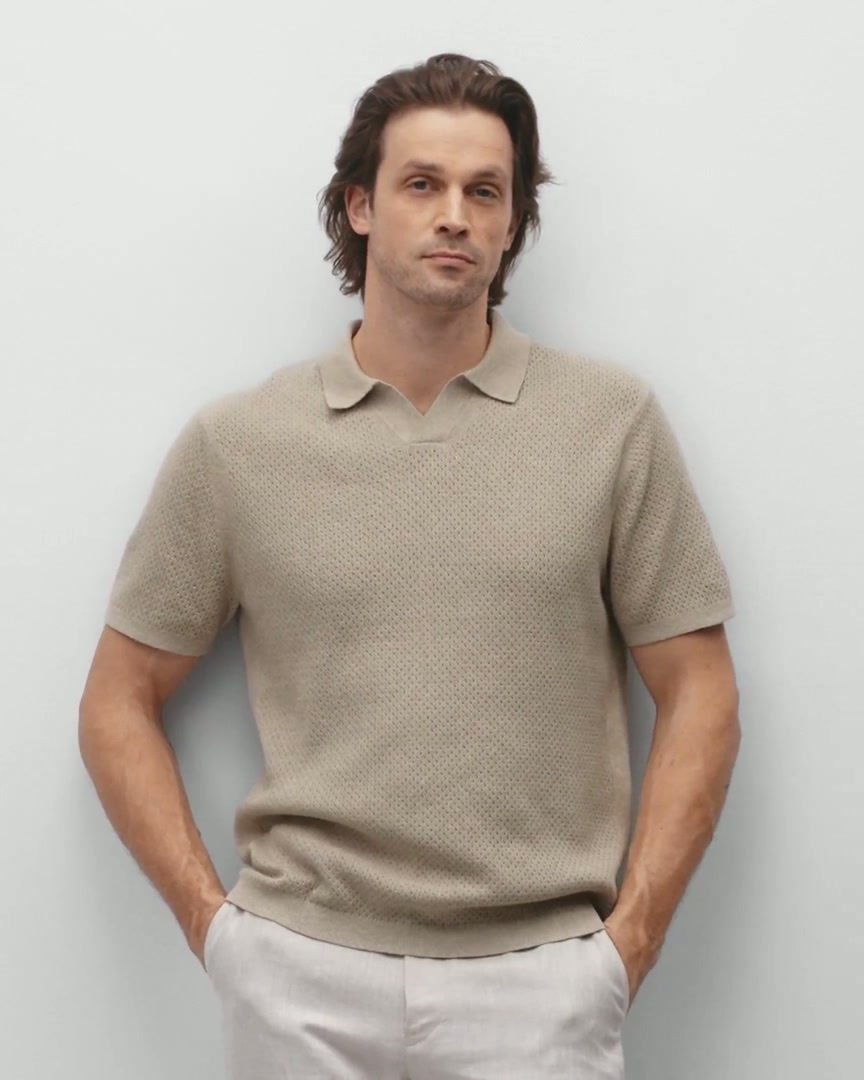 Reigning Champ Victor Polo in heather oatmeal cotton linen on male model front close pose