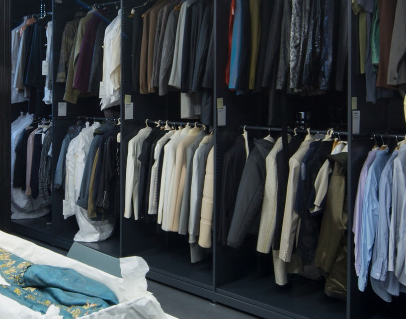 Garments hanging in the Westminster Menswear Archive