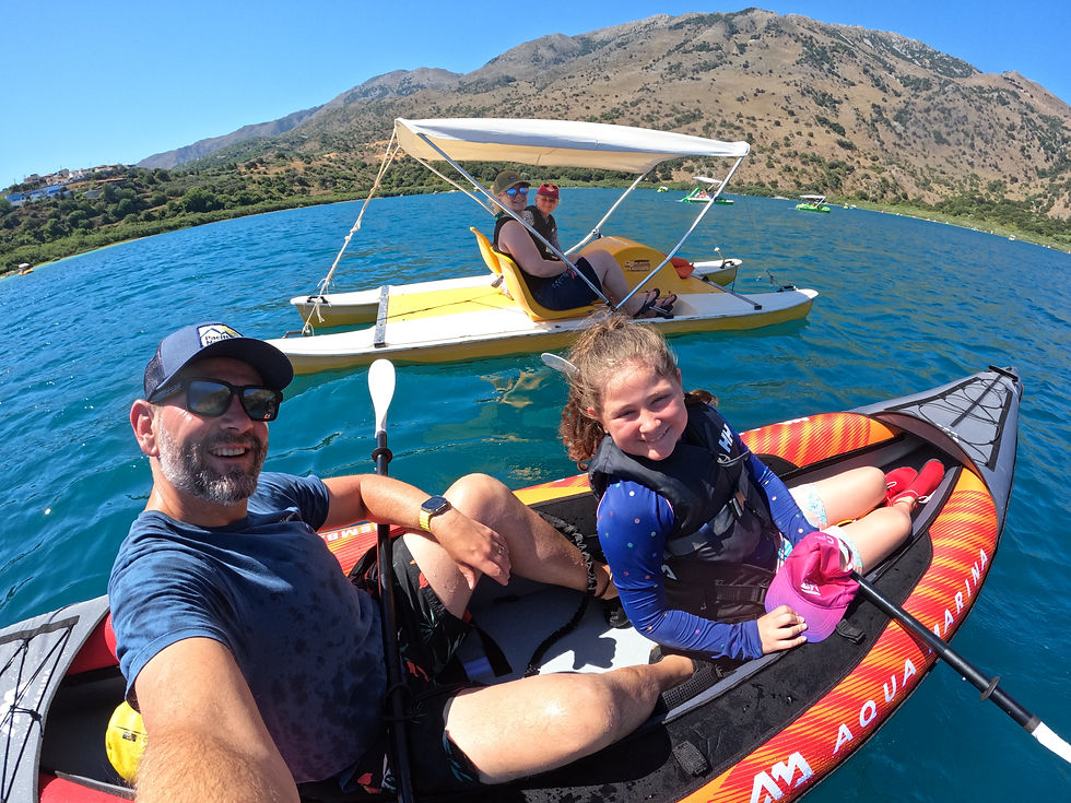 Family kayaking on Lake Kournas Crete in Aqua Marina Memba 390 inflatable kayak with mountains in background