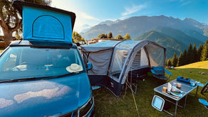 Vango Galli 3 drive-away awning pitched alongside a VW T6 campervan in the Swiss Alps
