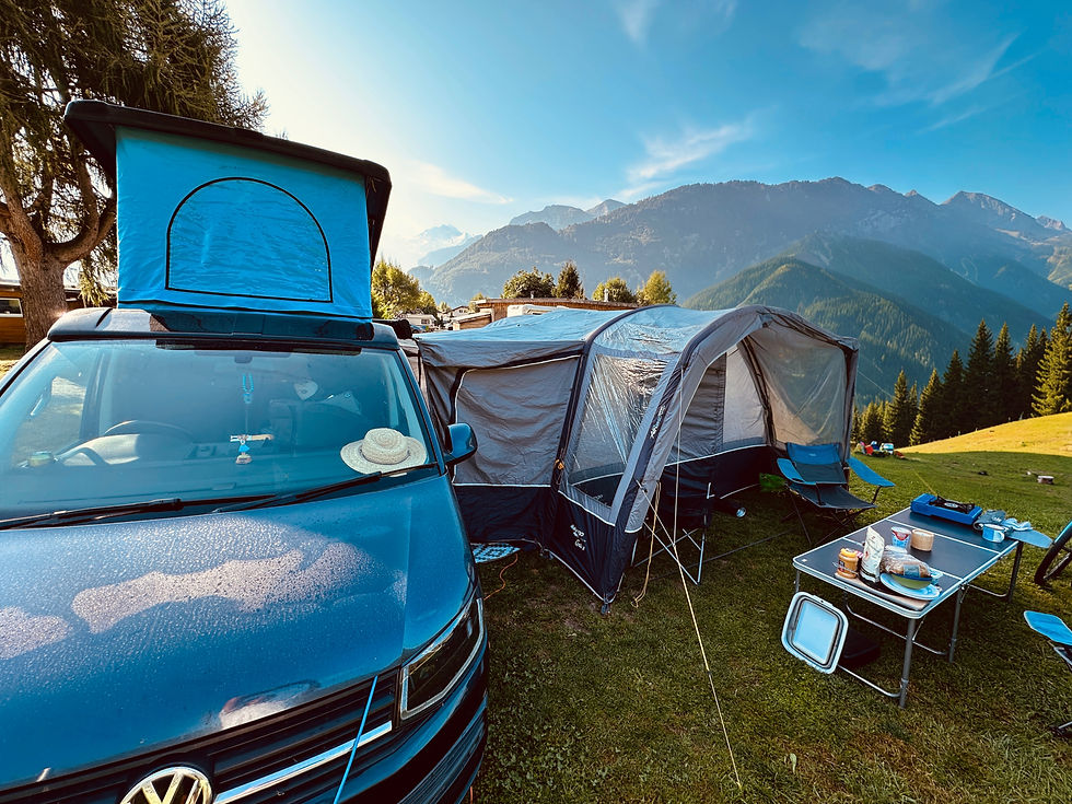 Vango Galli 3 drive-away awning pitched alongside a VW T6 campervan in the Swiss Alps