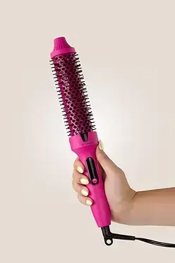 Thumbnail: Pink Luxe + Willow Volumizing Extra Long 1.5 inch Thermal Brush held in hand for voluminous blowout styling.